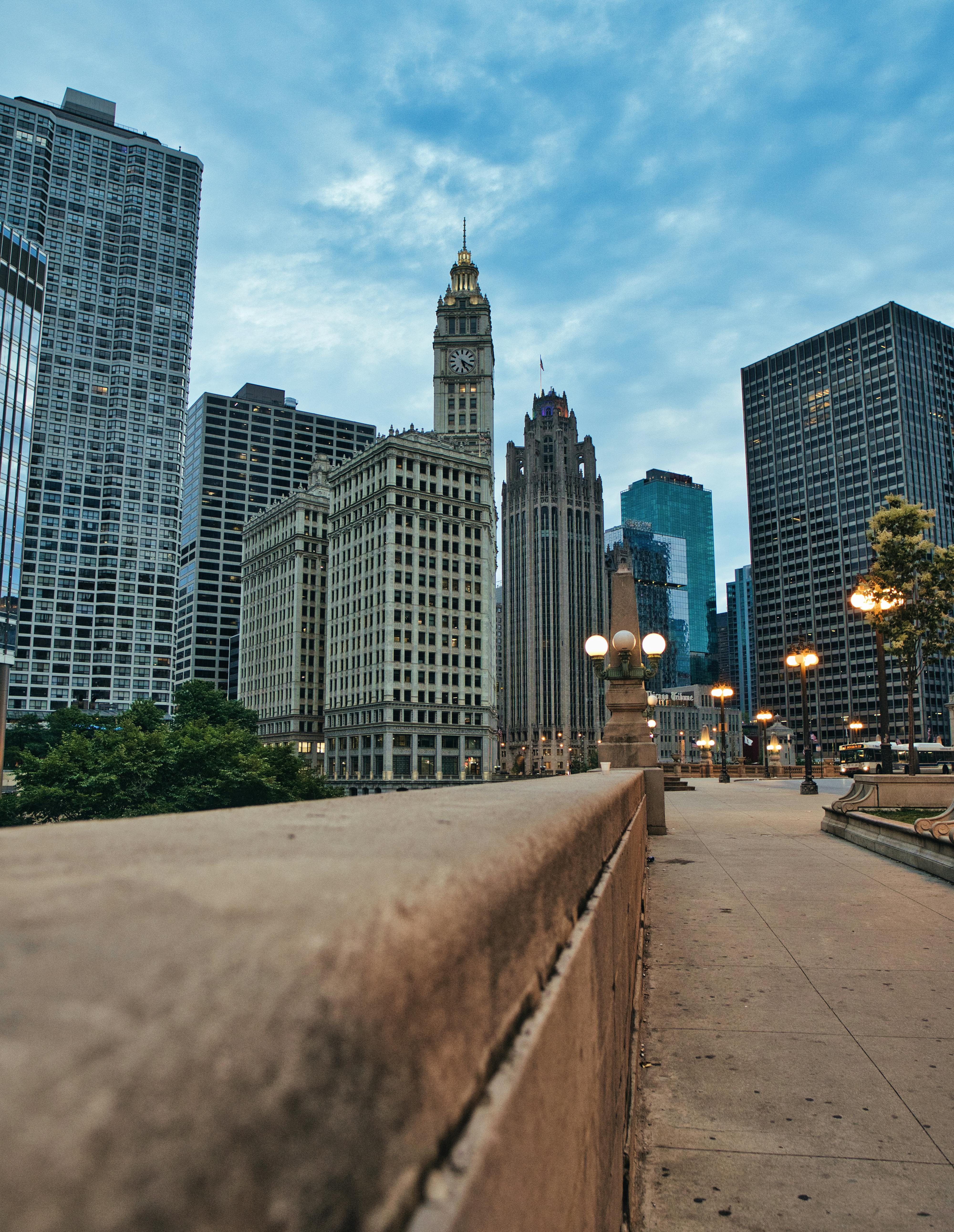 Capture of the iconic Chicago skyline featuring Wrigley Building and Tribune Tower on a calm day.